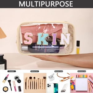 Detail showing the large capacity of the PVC cosmetic bag with SKIN chenille patches