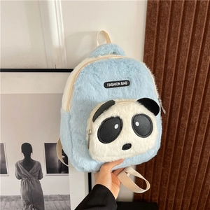 Detail of soft blue plush panda backpack featuring a FASHION BAG woven label