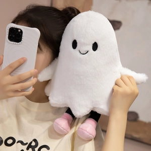 Close-up of cute white plush ghost toy with pink boots held by a model on her shoulder