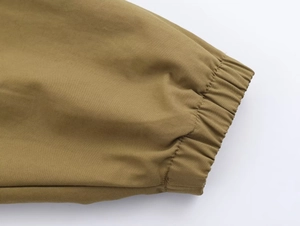 Detail shot of khaki brown bomber jacket elastic cuffs with premium cotton twill texture