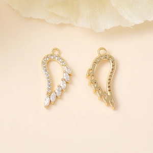 Golden wing charms with zircons for DIY necklaces, showing stone-set and hollow frames