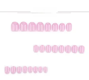 Detail view of pink pearlescent press-on nails with white French tips in 24 pieces set