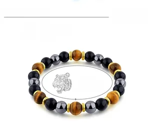 Detail of 8mm tiger eye and hematite beaded bracelet with 6.6 to 8.2 inch adjustable size