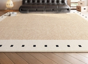 Detail of vintage French style rug featuring geometric texture and modern black border