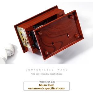 Detail view of the ABS plastic base with faux wood grain for vintage sewing machine music box