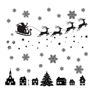 Christmas window decals with black silhouette of Santa, reindeer sleigh and snowy town