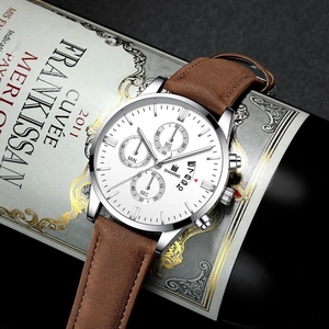 SHAARMS men's quartz watch with brown leather strap and silver case on a wine bottle