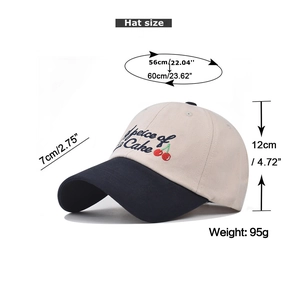 Detail of embroidered cherry baseball cap showing dimensions 7cm brim and 56-60cm head size
