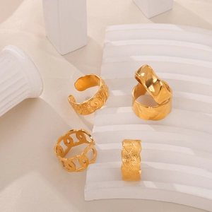Set of four vintage-style gold plated stainless steel textured rings for women
