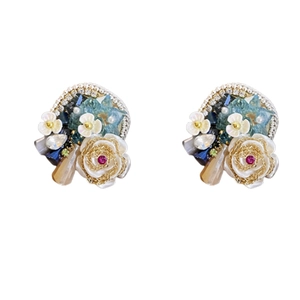 Elegant floral stud earrings featuring white roses and blue crystals with pearls