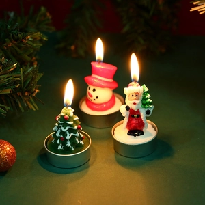 Lit Christmas candle set with Santa, Snowman and Tree figures in metal holders