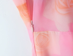Detail of the invisible zipper and sewing on this pink floral print maxi dress