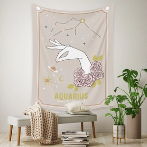 Detail of Aquarius zodiac tapestry with hand-drawn roses and celestial sun and moon patterns