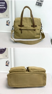 Detail view of khaki canvas messenger bag with leather accents and multi-pocket design