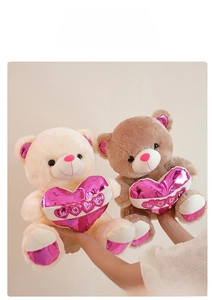 Detail of plush bears with metallic pink LOVE hearts and matching inner ears and paws