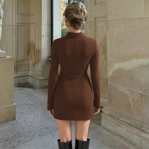 Rear view of brown bodycon mini dress featuring stand collar and ruched knit fabric