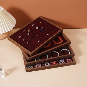 Stackable walnut wood grain jewelry organizer trays with red velvet lining for display