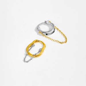 Close-up of S925 sterling silver hallmark on gold and silver tassel earrings