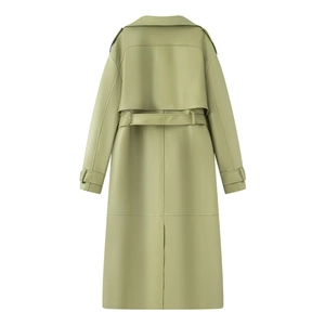 Detail view of the back of a slim fit sage green long leather trench coat with yoke