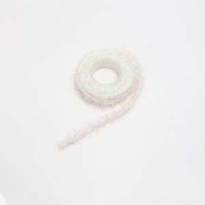 Detail of iridescent laser tinsel ribbon in pastel purple for DIY gift wrapping