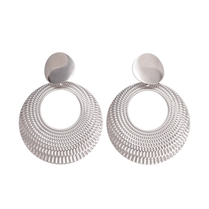 Minimalist silver hollow round metal earrings with textured finish on white background