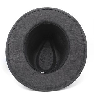 Vertical top view showing the inner lining and tight woven texture of a black straw hat