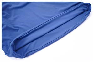 Macro view of bright blue high waist mini skirt showing double-needle hem and knit fabric
