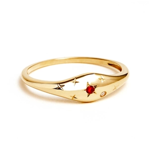 Macro view of gold S925 silver ring with star engraving, ruby and diamond accents