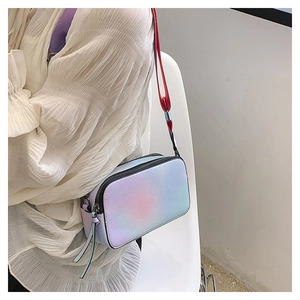 Detail of colorful gradient camera bag with dual zippers and wide shoulder strap