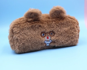 Close-up of soft brown plush pencil case with cute bear ears and embroidered bear detail