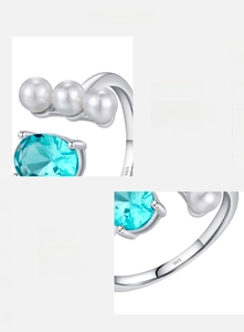Close-up of S925 sterling silver ring with blue topaz gemstone and white round pearls