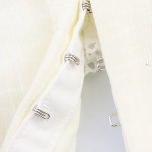 Off-white puff sleeve shirt featuring delicate lace stitching and metal hook-and-eye closure