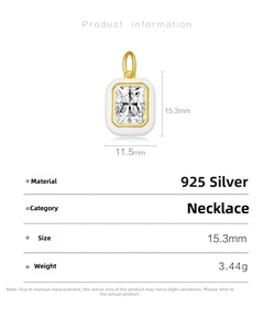 Detail of S925 silver gold-plated evil eye pendant with white enamel and cubic zirconia