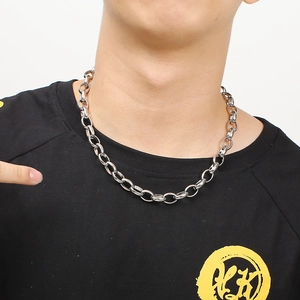 Chunky silver stainless steel link chain necklace worn on a black t-shirt streetwear style
