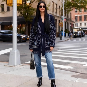 Women's navy blue paisley knit cardigan with fringe hem and tie-waist belt in street style