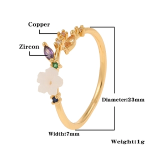Macro view of gold flower ring with zircon stones and detailed brass material specifications