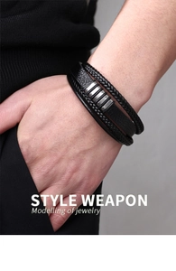 Close-up of men's multi-layer black leather bracelet with magnetic stainless steel clasp