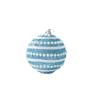 Blue glitter Christmas ball ornament with white pearls and lace trim on a white background