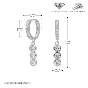 Macro view of S925 sterling silver hoop earrings with triple dangling cubic zirconia stones