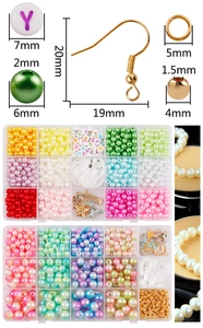 Macro detail of 15-grid jewelry making kit with gradient pearls and letter beads