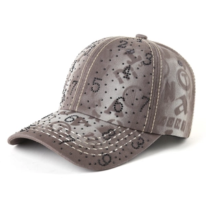 Vintage washed brown baseball cap with black rhinestone numbers and outdoor sun protection