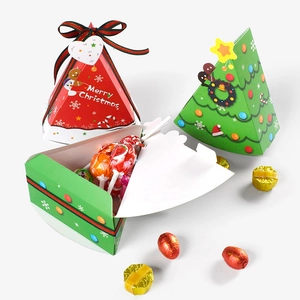 Christmas tree shaped cone gift boxes in red and green with ribbon bows and candy inside
