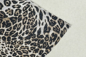 Detailed view of lightweight leopard print fabric texture and high-quality hem stitching