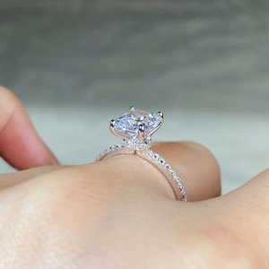 Detail of s925 silver ring featuring rectangle cut zircon and hidden halo setting