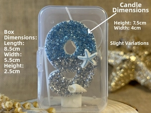 Detailed view of ocean theme number 9 birthday candle with blue glitter and seashells