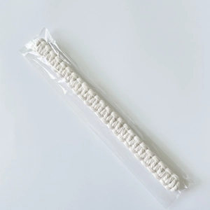 Handmade white braided cotton curtain tieback in transparent packaging for Nordic home decor