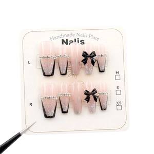 Handmade black French press-on nails with silver glitter, rhinestones and 3D bows