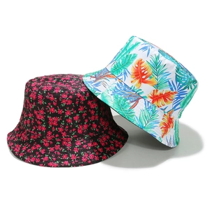 Reversible cotton sun hat with floral and tropical leaf prints for summer fashion