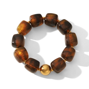 Retro amber resin beaded bracelet with golden metal bead in minimalist vintage style