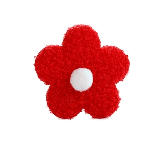 Red teddy fleece flower accessory with white center and five petals on white background